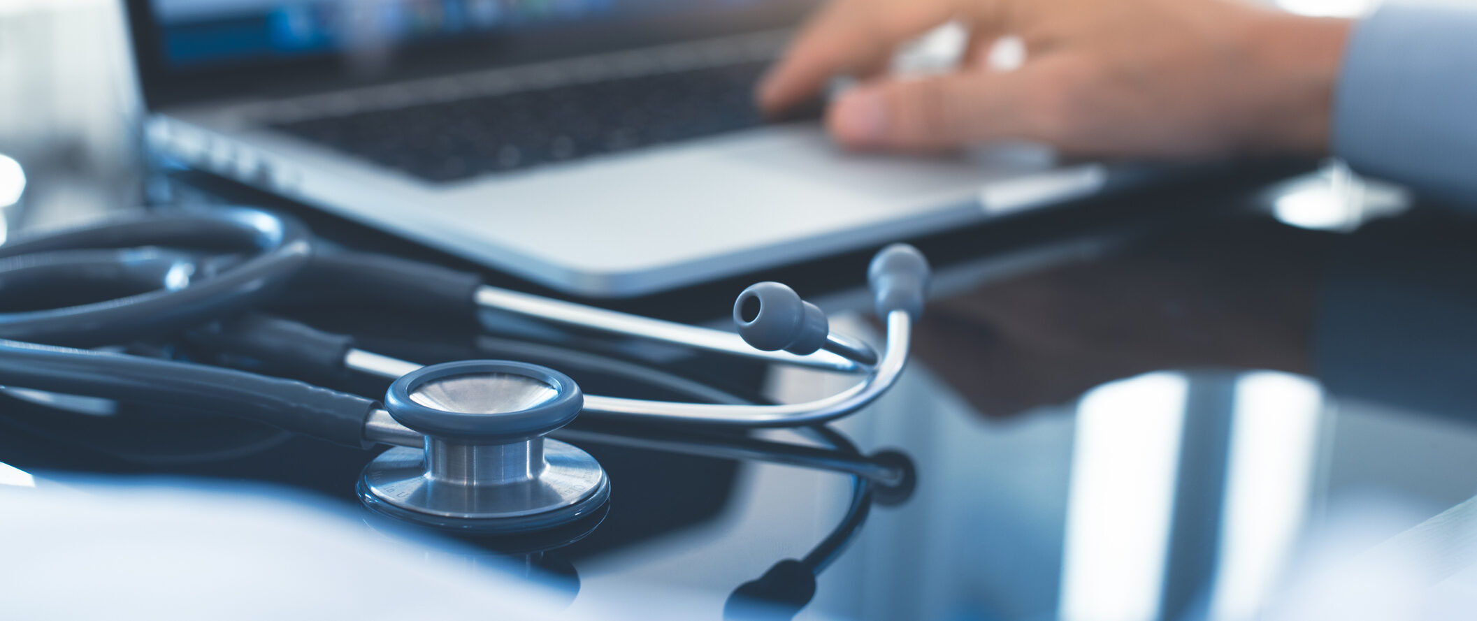 Doctor working on laptop computer